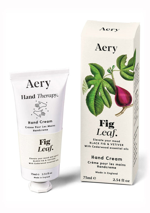 Cream Fig Leaf hand cream displayed next to product packaging on white bacground 