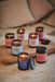 collection of aromatherapy jar candles by aery displayed on wooden tray
