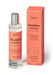 Orange Positive Energy room mist displayed next to product packaging on white bacground